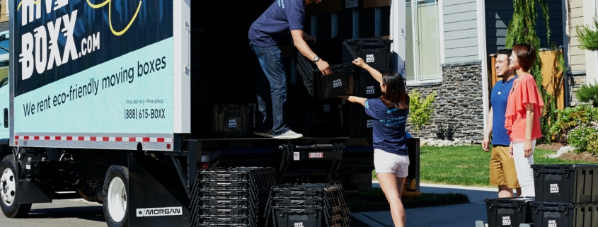 putting crates into moving truck