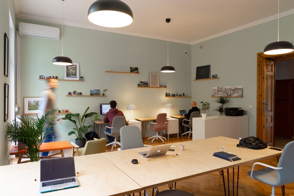 Open workspace, one employee working in the back