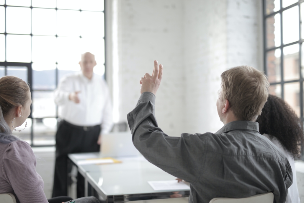 Man raising his hand